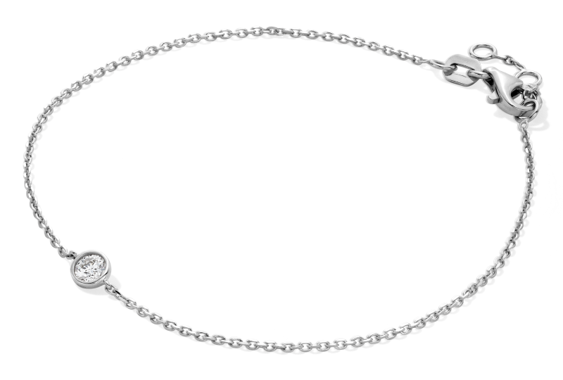 White metal bracelet featuring a bezel set round diamond.