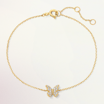 A gold bracelet with a diamond butterfly.