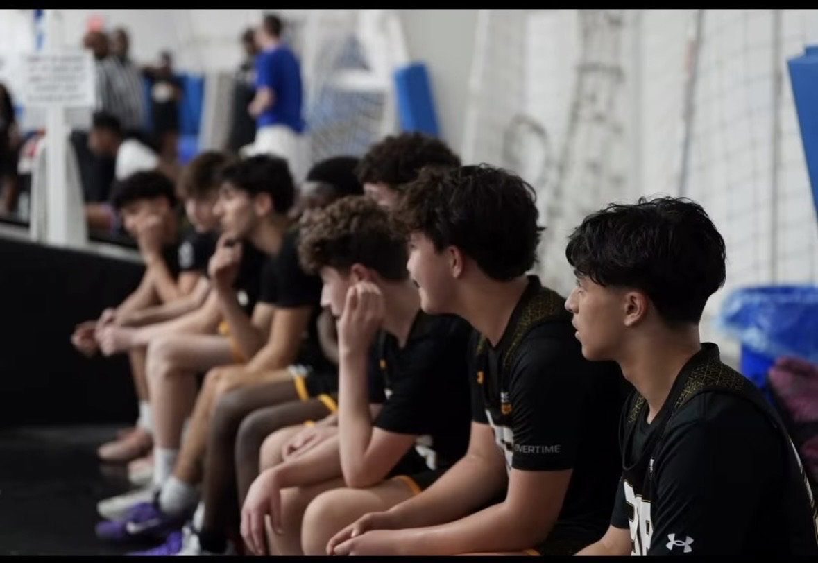 PSB players watching the game from the bench