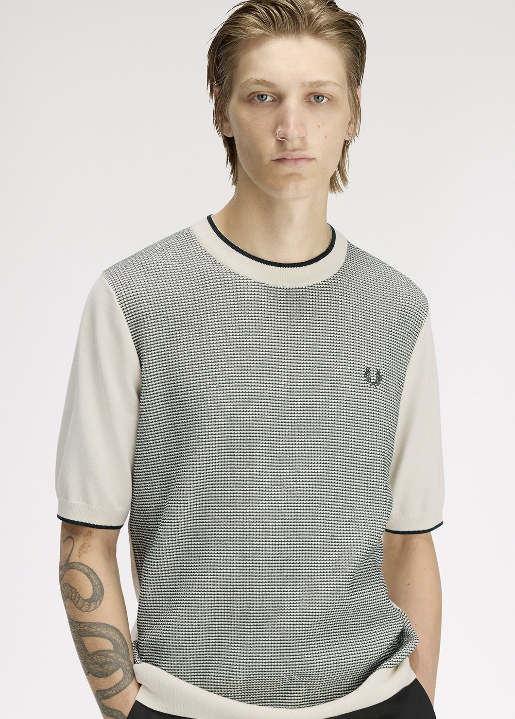 Male model wearing a Fred Perry Tonic Waffle Knitted T-Shirt in Ecru 