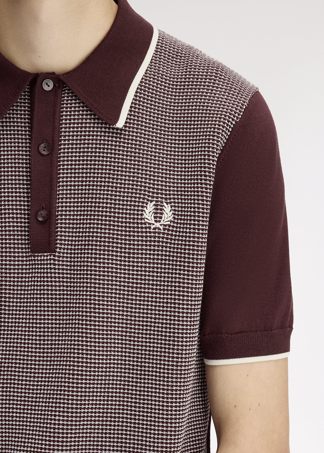 Close up of a Fred Perry Tonic Waffle Knitted Shirt in Oxblood