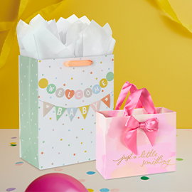Two gift bags with tissue paper.