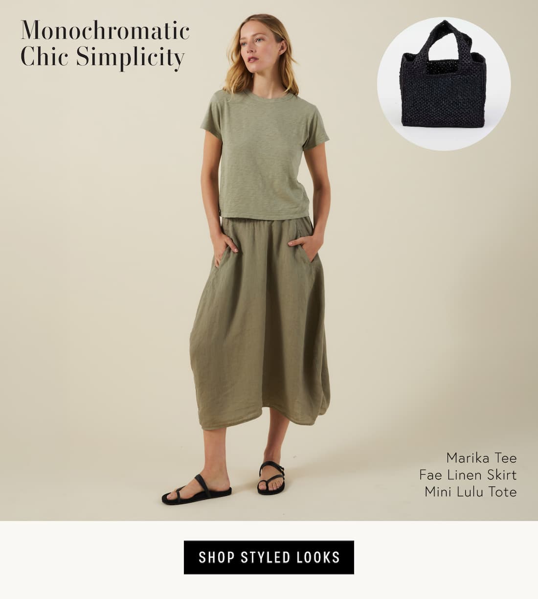 Image shows model wearing the Marika Top and Fae Skirt in Axe, styled with the Mini Lulu Tote in Black. Text reads: Monochromatic Chic Simplicity featuring Marika Tee Fae Linen Skirt Mini Lulu Tote
