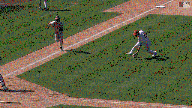 An animated gif of Angels pitcher Chase Silseth flipping the ball with his glove to catcher Logan O'Hoppe for an out at the plate