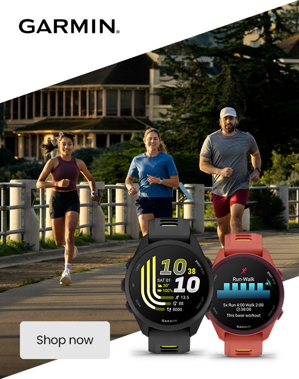 Three people running along a riverside path with Garmin GPS fitness smartwatches displayed in the foreground showing workout metrics and run-walk tracking.