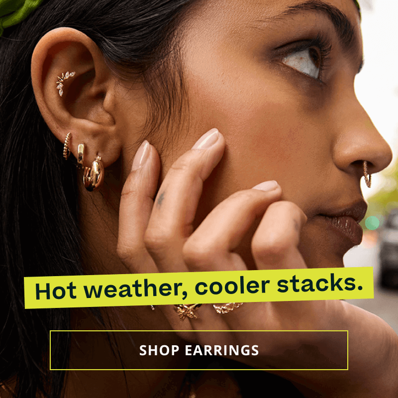 Model with gold hoops, huggies, climber & septum hoop. Hot weather, cool stacks. Click here to shop earrings