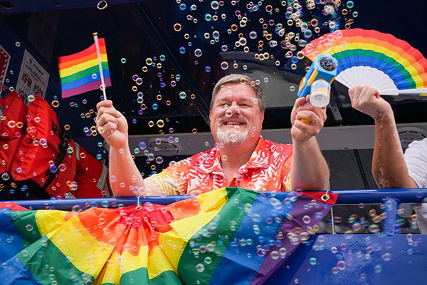 Person celebrating at a Pride parade.