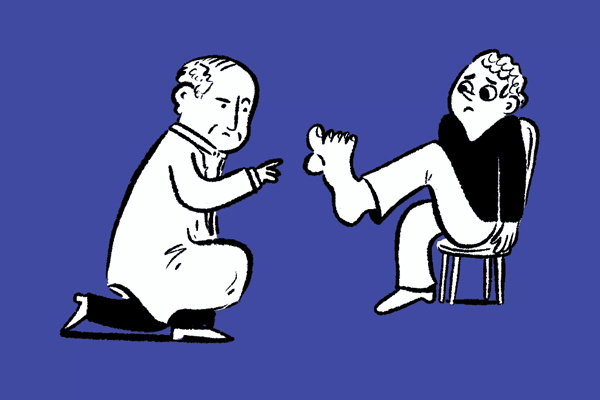 Physician examining a foot.