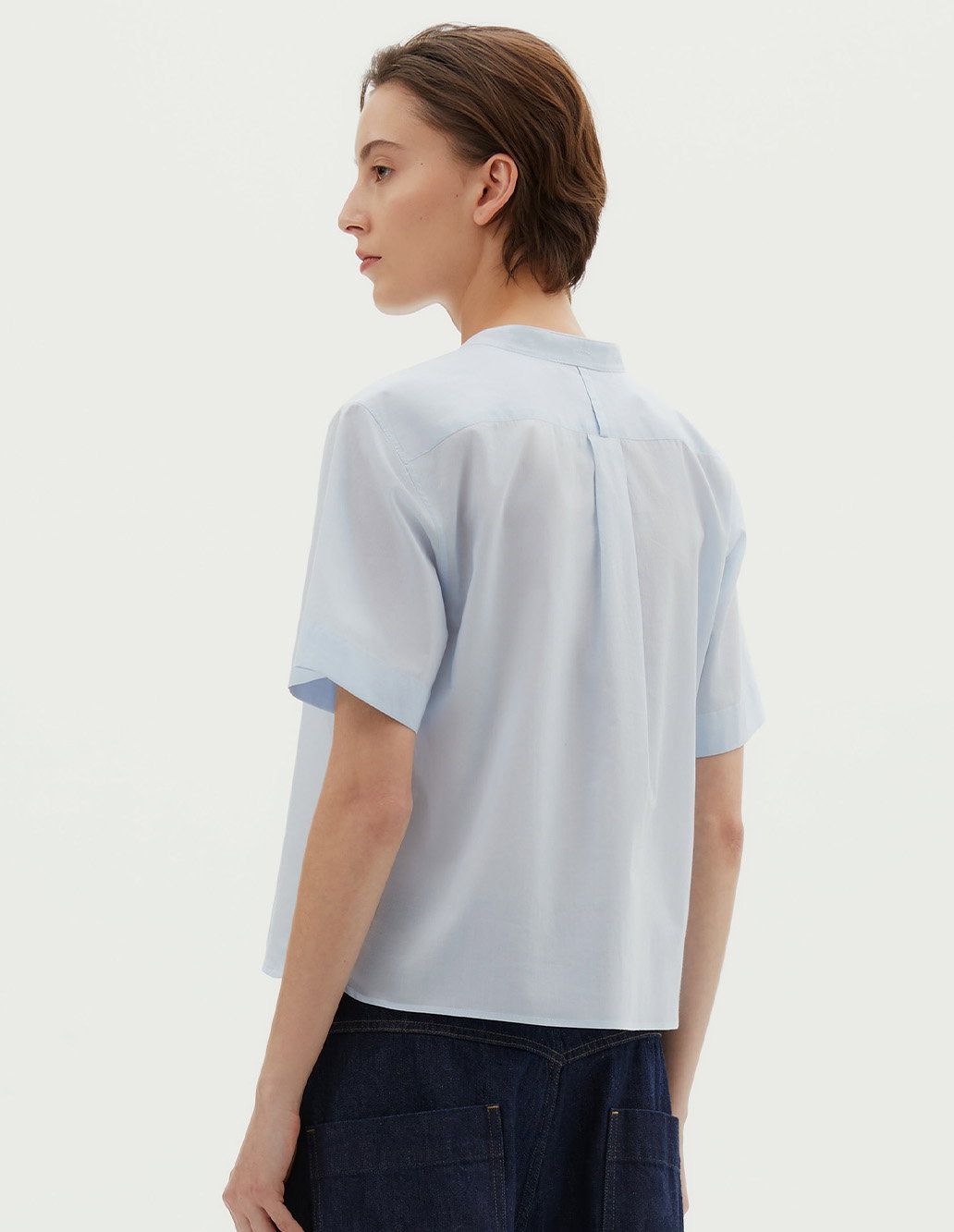 Light blue cotton blouse.