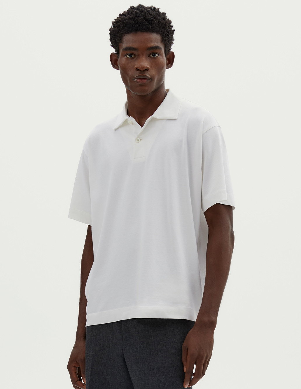White polo shirt.