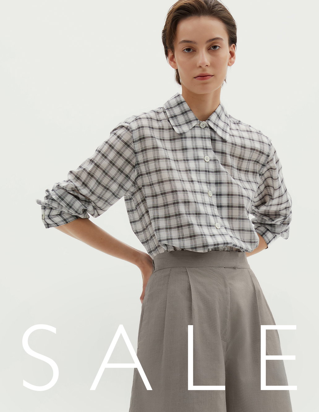 Sale High Summer Edit. Checked shirt and grey shorts.
