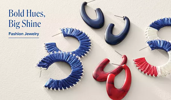 Bold hues, big shine. Fashion jewelry. Different pairs of red, white and blue earrings.