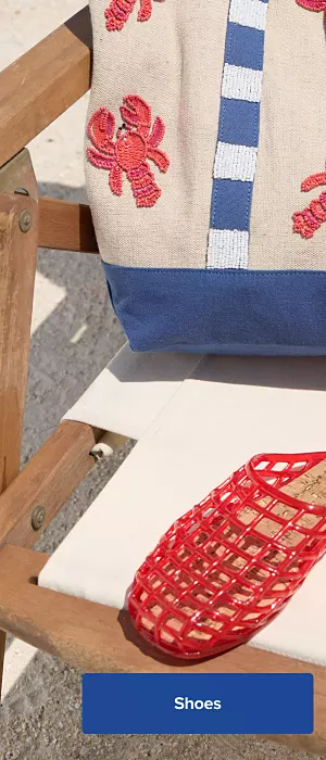 A tote bag with lobsters on it and a pair of red jellies. Shoes. 