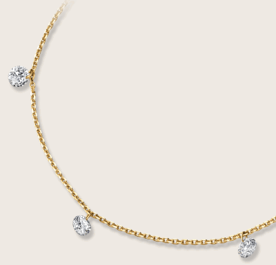 Yellow gold diamond station necklace with delicate chain.