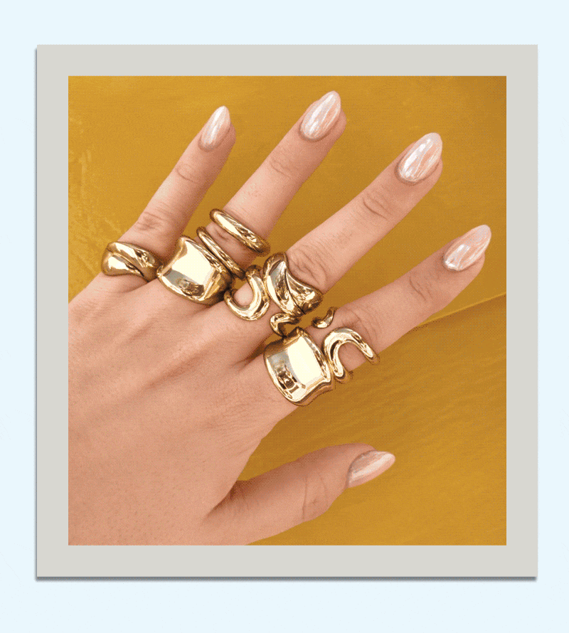 Rotating close up polaroids of  gold rings, a bracelet stack and layered necklaces.