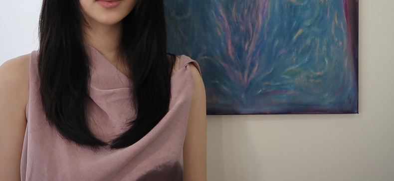 photo of Siting with her art collection