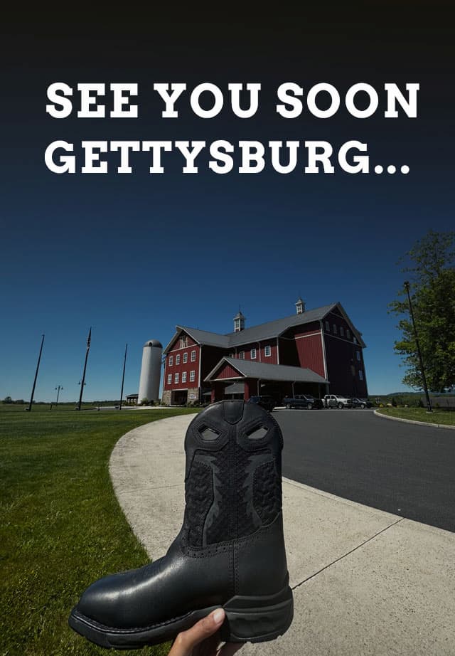 See you soon Gettysburg... Person holding a black Phantom rider boot in front of a red building. Find a Super shoes store near you.