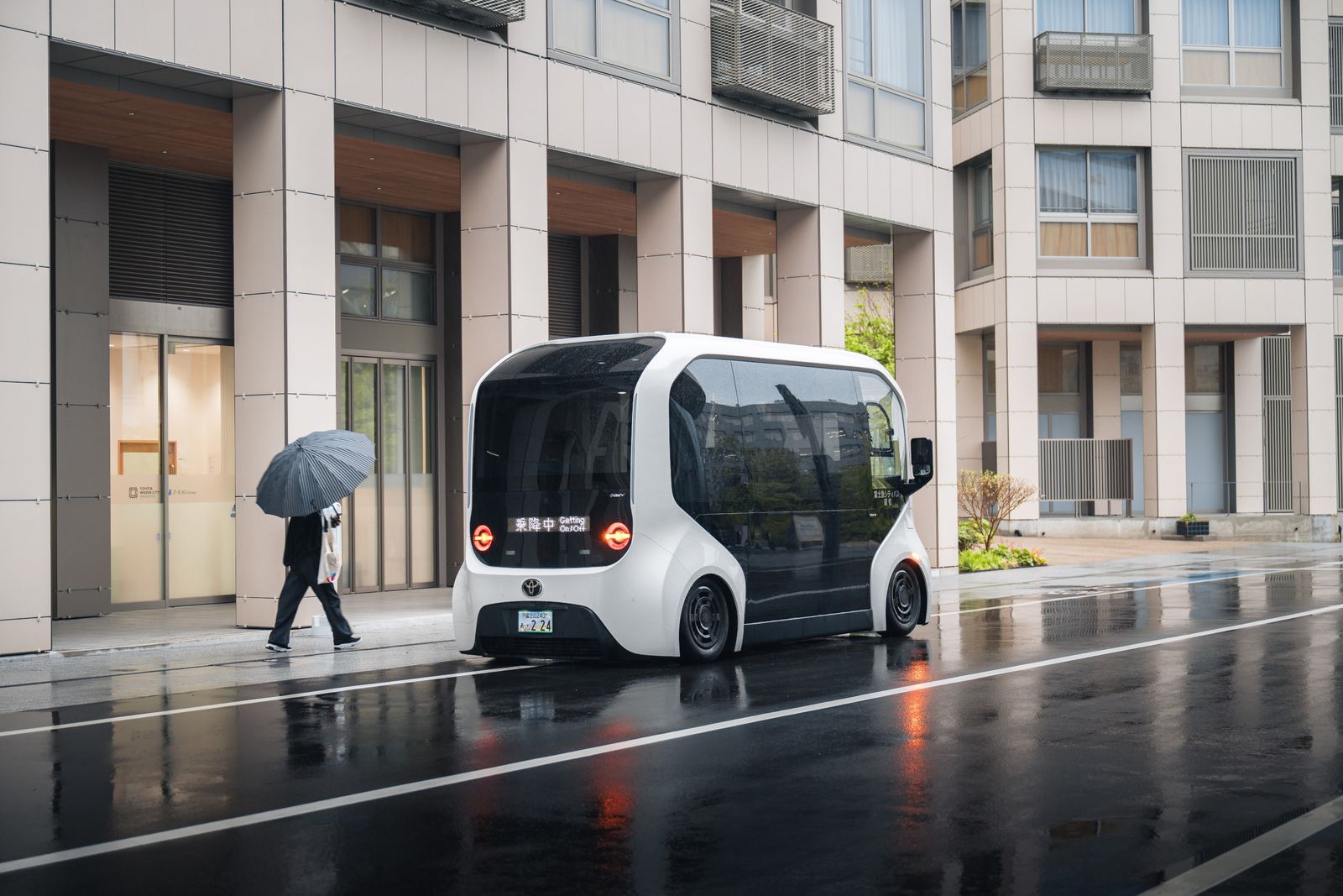 futuristic micro bus on city street