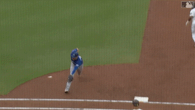 An animated gif of Freddie Freeman making a jump throw for an out