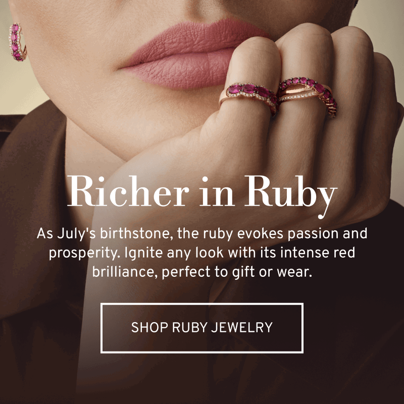 Model wearing rose gold and ruby rings. As July’s birthstone, the ruby evokes passion and prosperity. Click to Shop Ruby Jewelry