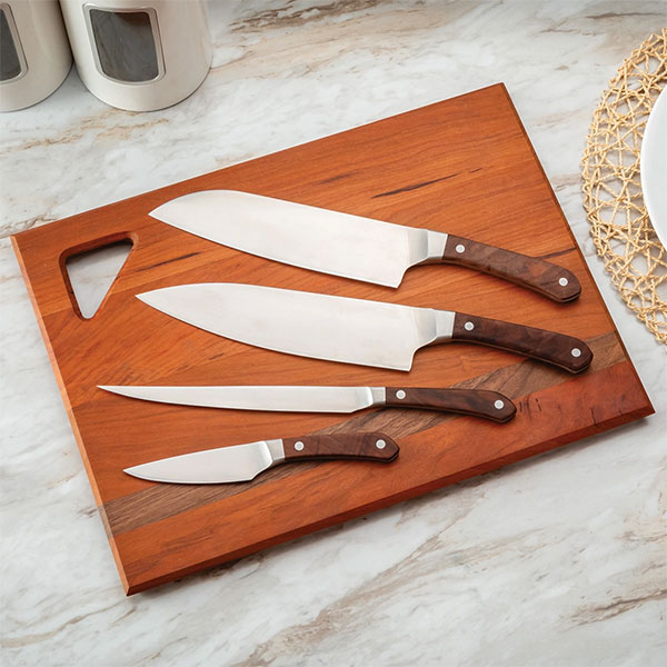 Knives laid out on a cutting board