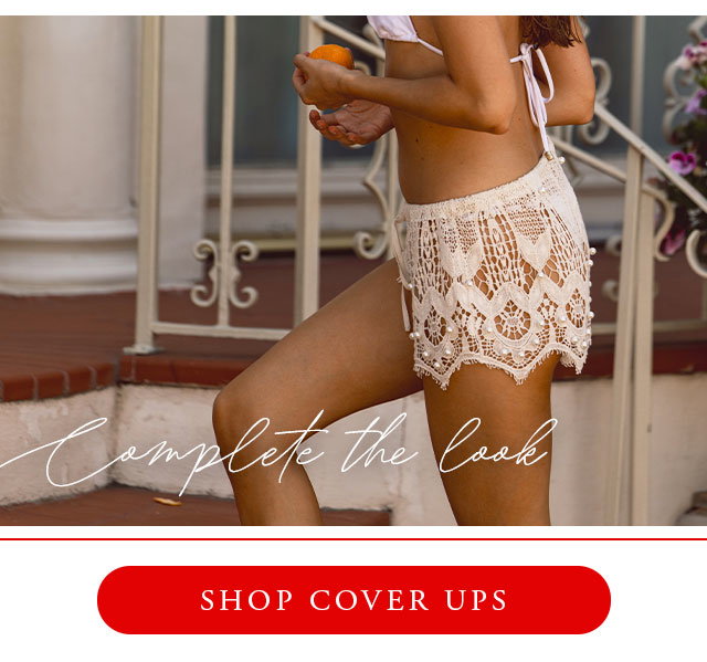 White crochet lace shorts with pearls. Shop cover ups. 
