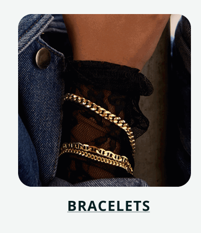 Various style gold chains on wrist. Click here to shop bracelets