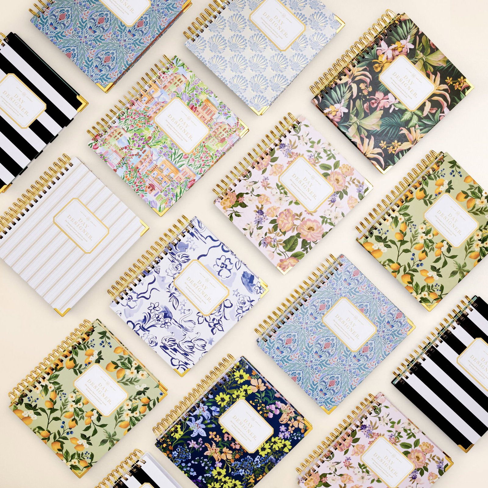 diagonal rows of day designer planners in assorted pretty patterns 