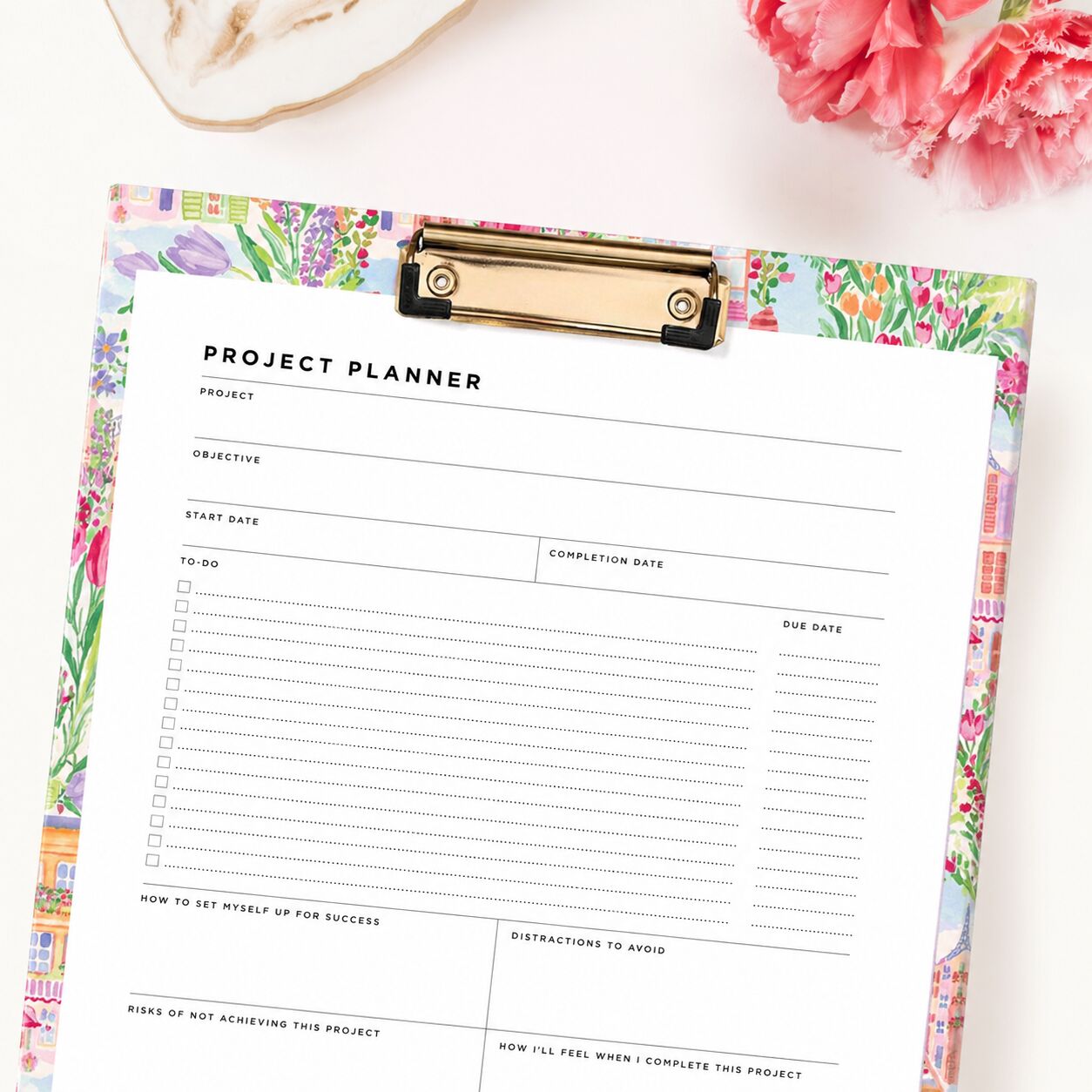 project planner printable shown on pretty clipfolio, beige background, pink flowers