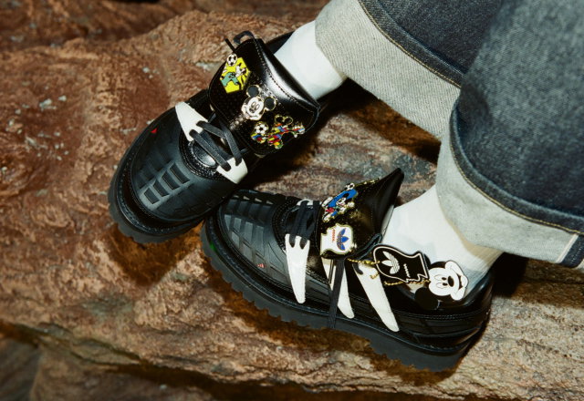 Close-up of a model wearing shoes from the new adidas Originals x Brain Dead by Disney collection.