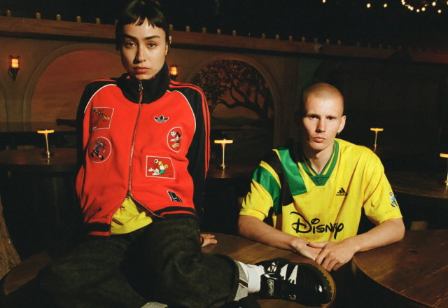 Two models wearing apparel from the new adidas Originals x Brain Dead by Disney collection.