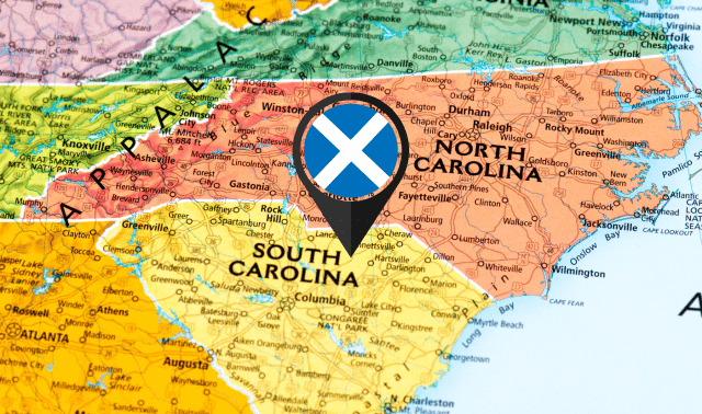 Map showing North Carolina and South Carolina with a location pin marked by a blue Scottish flag centered over South Carolina.