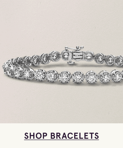 Silver tennis bracelet lined with continuous round diamonds. Click here to shop bracelets