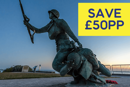 Bronze statue of a soldier helping a comrade, with a sunset backdrop and promotional text in the corner.
