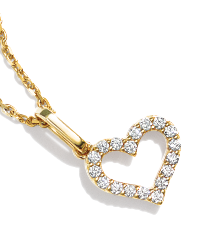 Diamond heart pendant on yellow gold chain. 