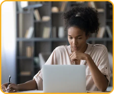 image-person-studying-on-laptop-and-taking-notes