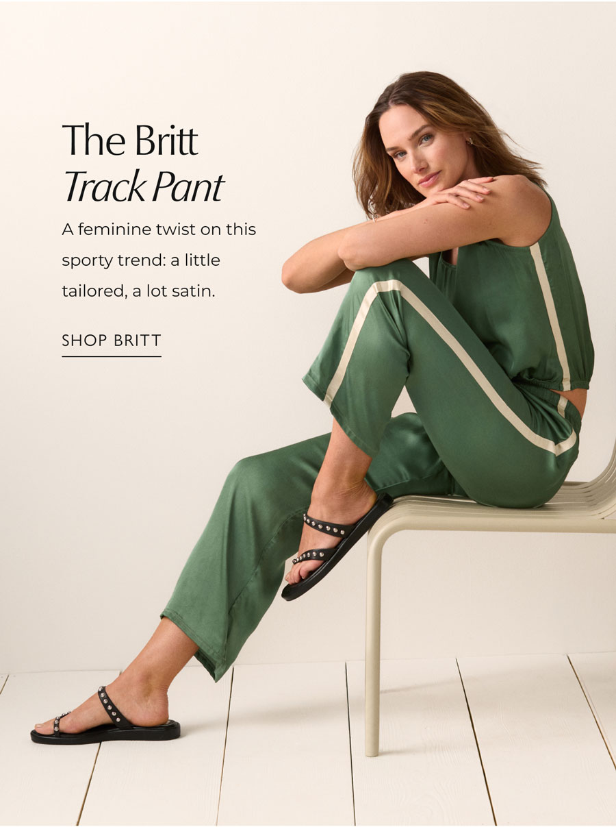 The Britt Track Pant  A feminine twist on this sporty trend: a little tailored, a lot satin. Image of model wearing feminine track suit.  SHOP BRITT
