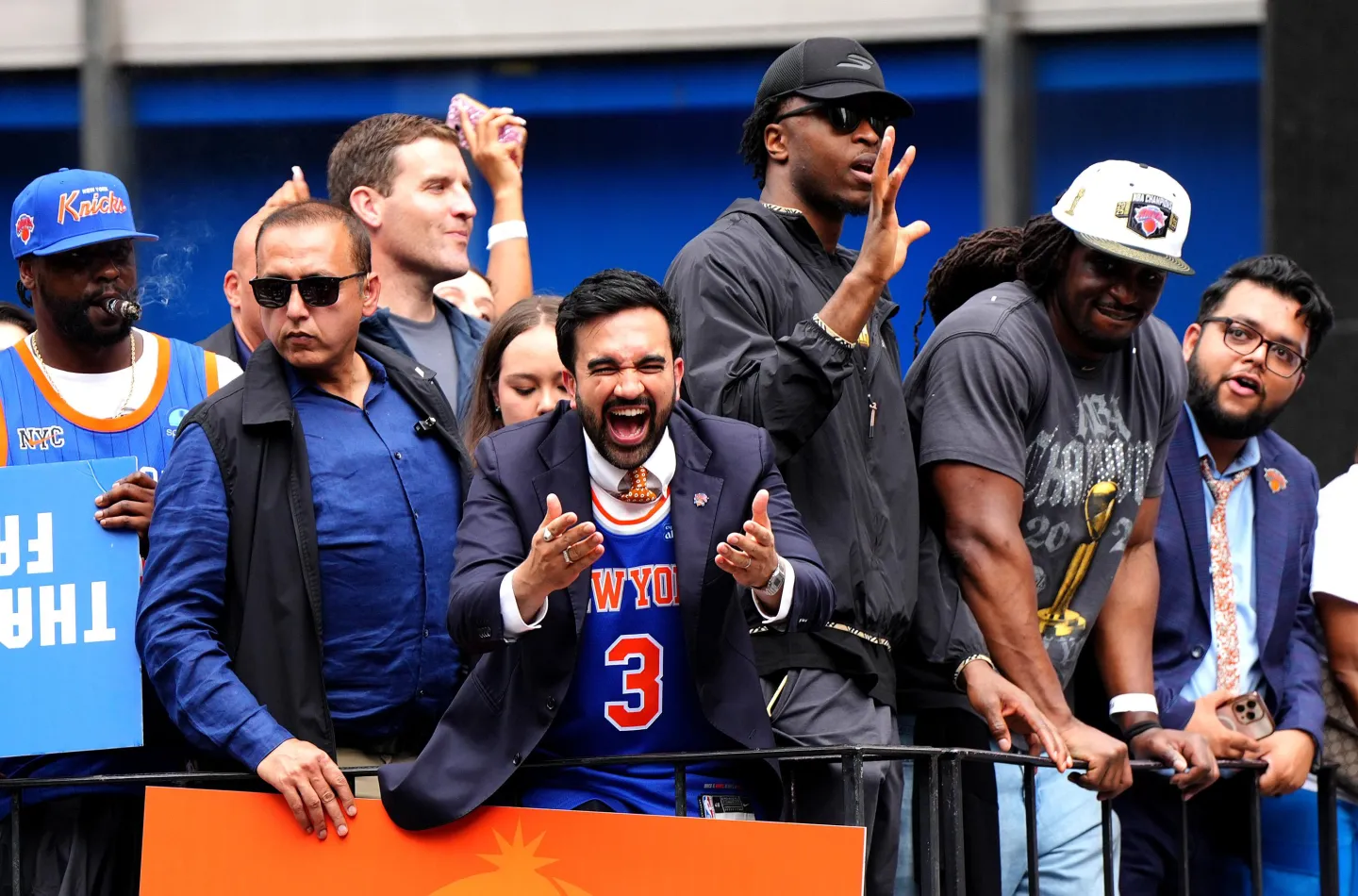 Mamdani bros out, cheering wildly in a Knicks jersey in the middle of a parade float.