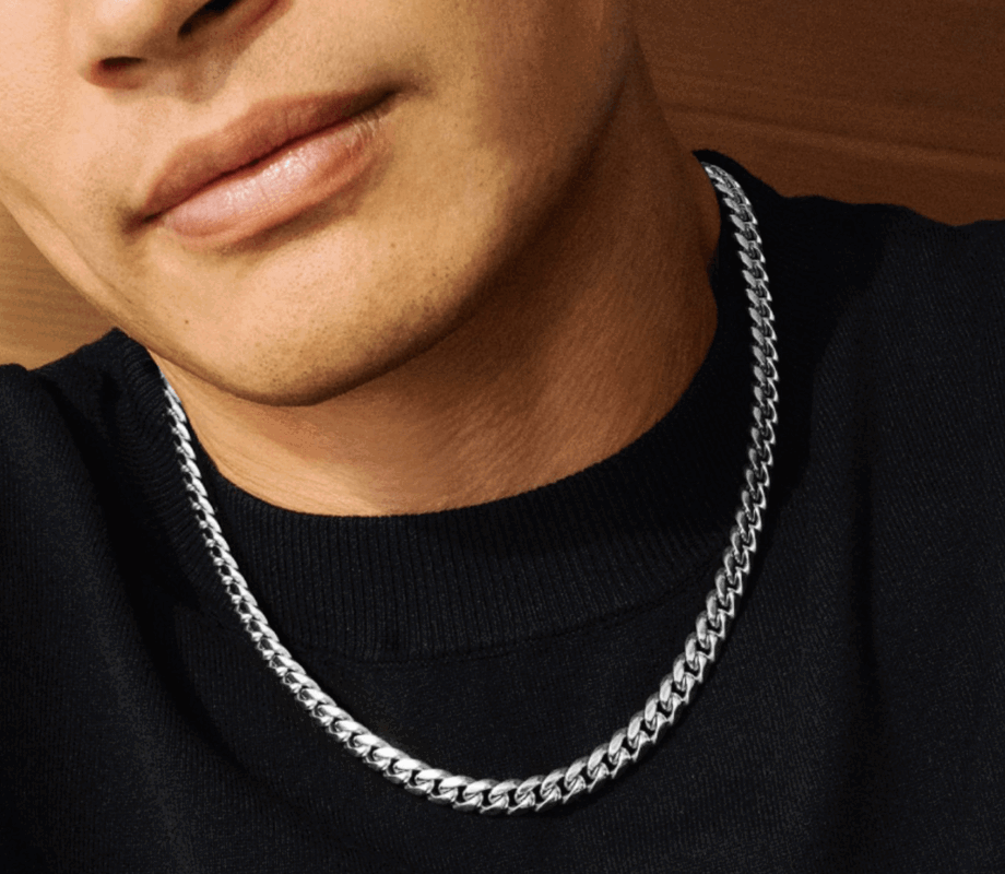 Man wearing a Solid Stainless Steel necklace from the JAXXON collection.