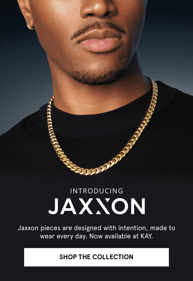 Man wearing a yellow gold tone Cuban link chain necklace from the JAXXON collection. Introducing Jaxxon. Click shop the collection.