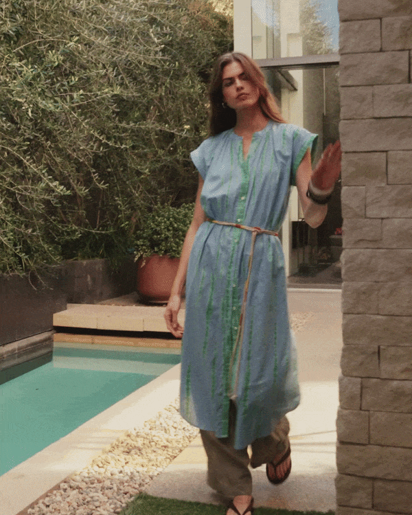 Gif shows a model wearing the Jada Dress in Sky Blue.
