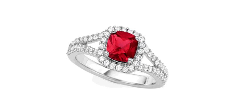 A ruby ring framed by a halo of diamonds. 