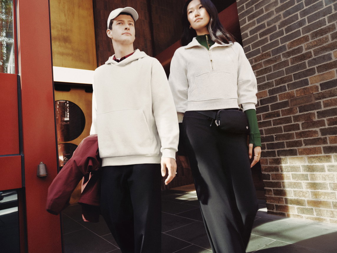 Man and women wearing lululemon outfit