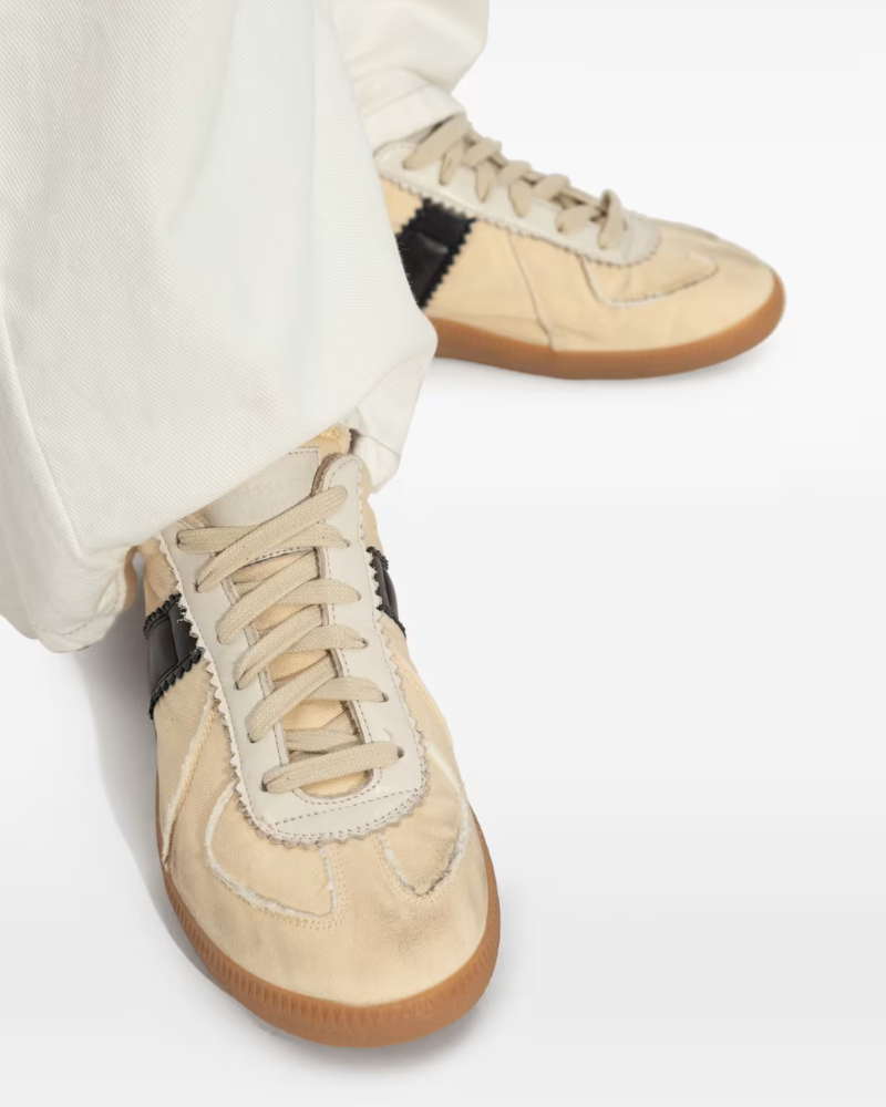 Maison Margiela Replica sneakers in Black and Vintage Yellow at Century 21 NYC