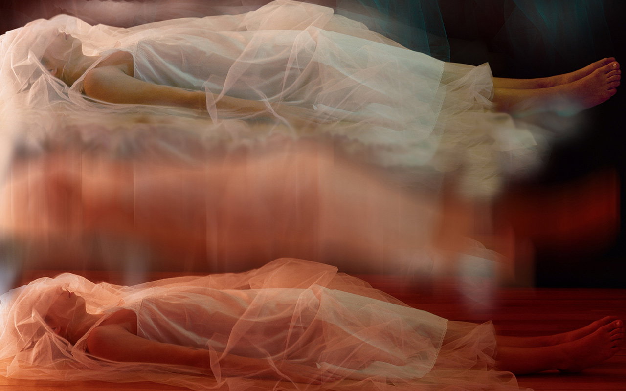 A multi-exposure image of a woman sleeping, giving the appearance of her sleeping self rising from her physical self.