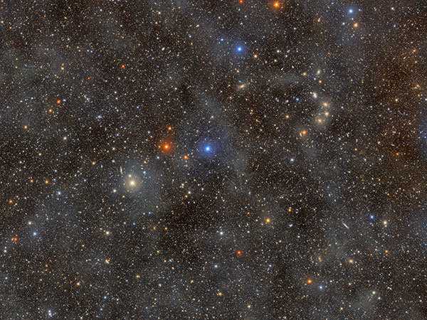 A 1.7-gigapixel image of a field of stars in the constellation Lupus. The faint, glowing clouds spread across this image are galactic cirrus.