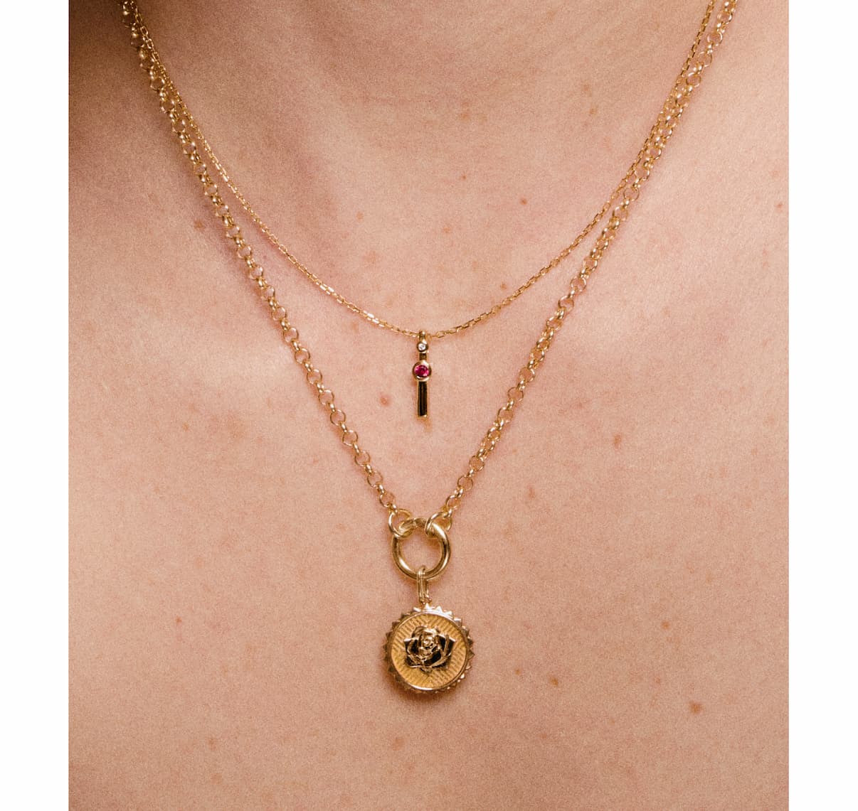 Layered Mejuri gold necklaces.