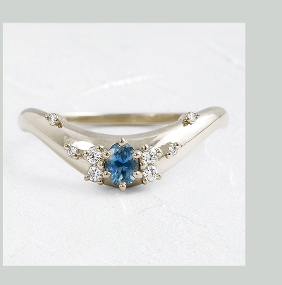 A 14k white gold Amplify Cluster Band in Sapphire shown on a textured white background.