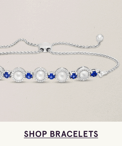 Adjustable bolo bracelet with alternating pearls & blue gemstones along chain. Click here to shop bracelets