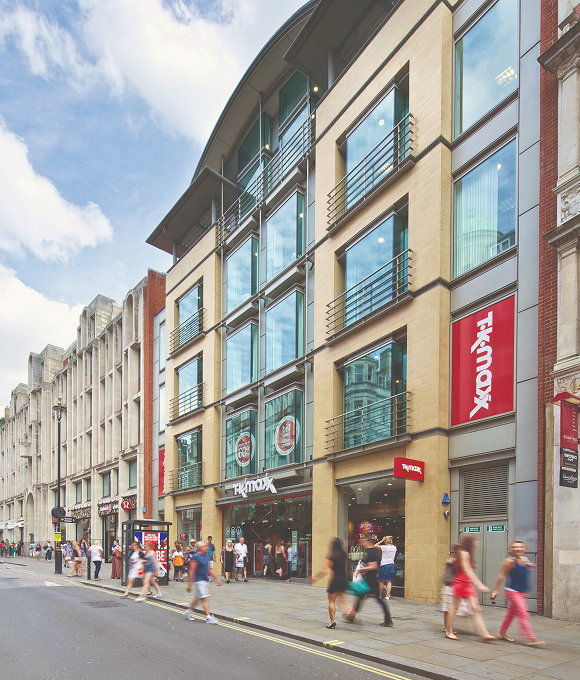 The exterior of a TK Maxx store on a street. 
